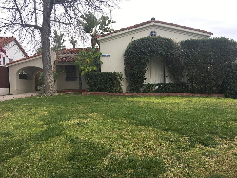 Charming Spanish home with setback and large grassy front la