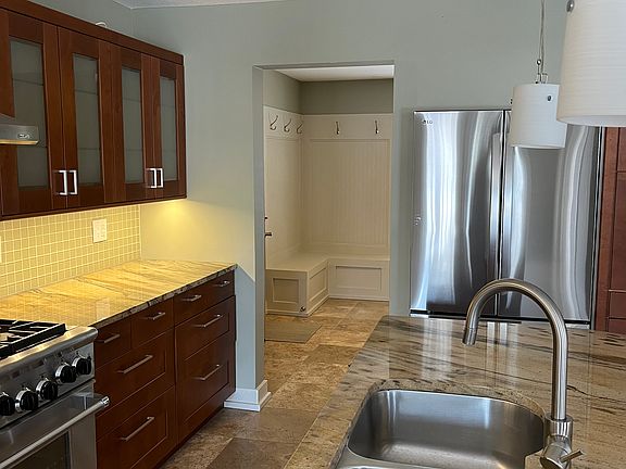 Kitchen looking into mud room off garage