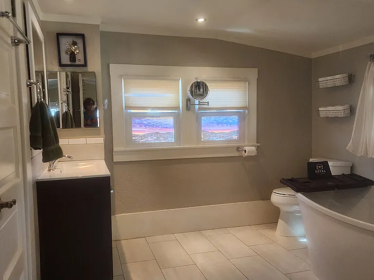Downstairs bath between utility room and main bedroom