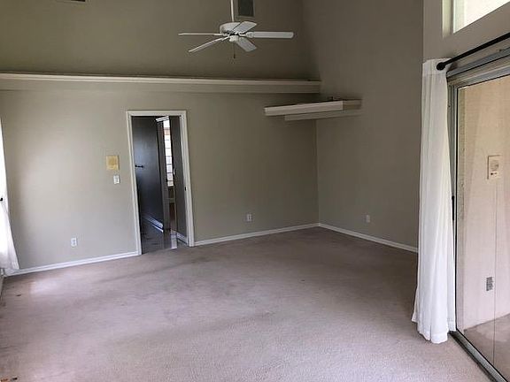 vaulted ceiling in master with TV shelf