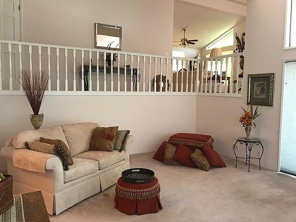 Front entry level family room with vaulted ceiling open views to living room