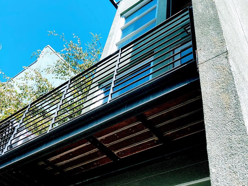 Front entrance of corner unit with 2nd floor wrap around balcony