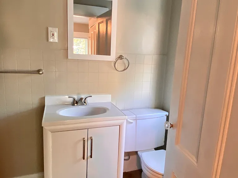 1/2 Bath off rear bedroom.