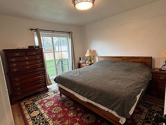 upstairs king, with sliding door to fenced yard
