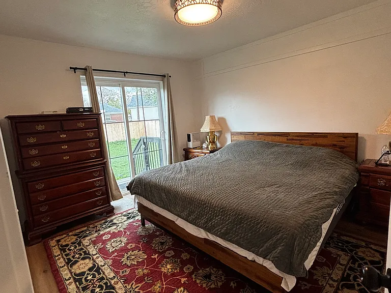 upstairs king, with sliding door to fenced yard