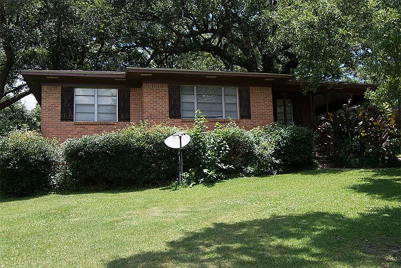 Summertime photo. Shade from large oak trees reduces summer cooling costs.
