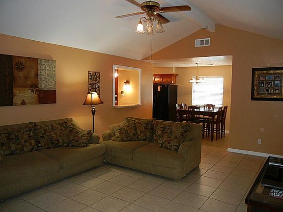 Living room has vaulted ceilings and is nice and open.