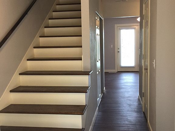 Entry, Hardwood stairs, new flooring, trim, paint, and doors