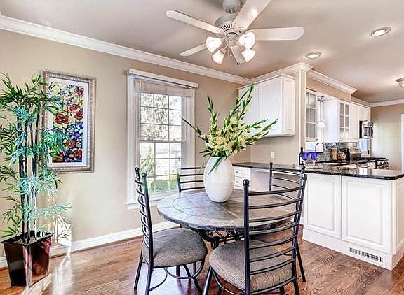 Breakfast room with additional breakfast bar seating and two pantries for storage