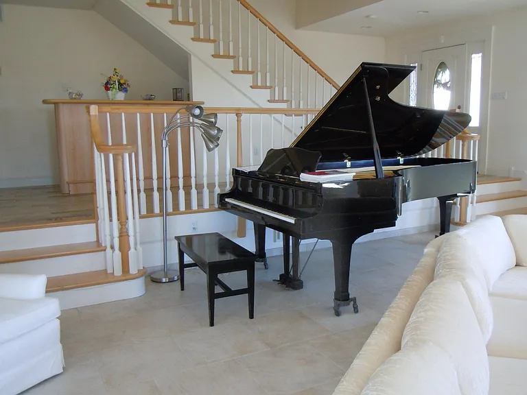 Yamaha 9 ft concert grand piano - bar and main stairway to bedroom floor