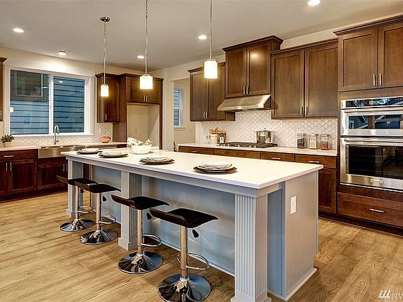Gourmet kitchen with center island.  Photo not of actual home - may contain optional features.