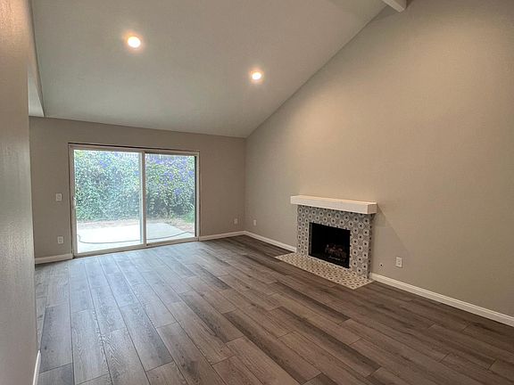 Vaulting living room ceiling with gas fireplace and french doors to be installed.