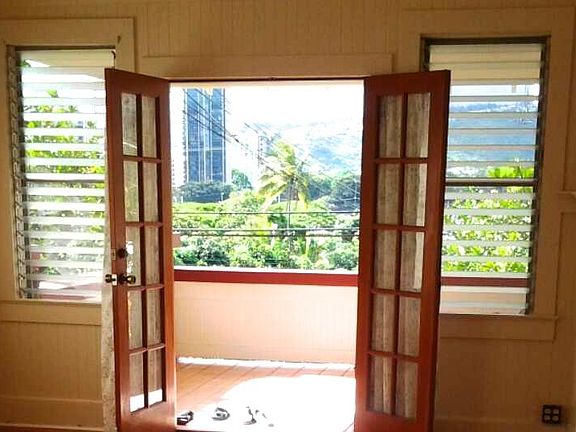 Welcome home! Beautiful, original French doors to oversized lanai. Previous renters have used the lanai as a dining area.