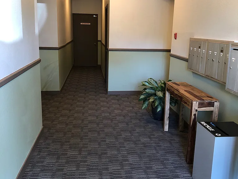 Welcoming entry and mail area; laundry room nearby.