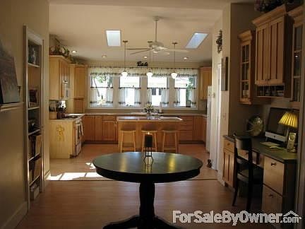 Large Open Kitchen
						:
						Bright kitchen large enough for the whole family w/ loads of cabinets & more!