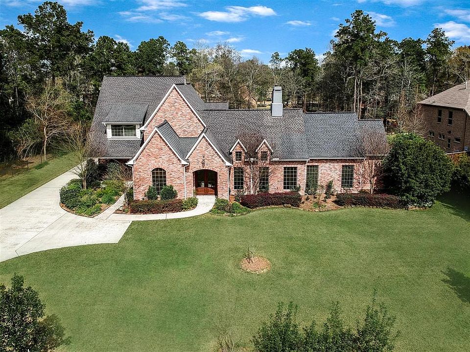 Benders Landing 1 plus acre 7 car garage custom home.