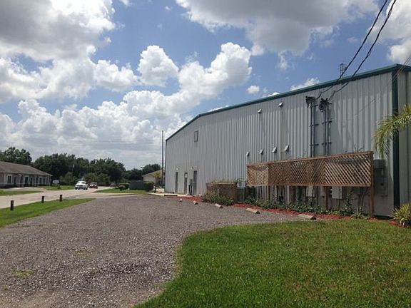 Side with Gravel Lot and additional exterior door