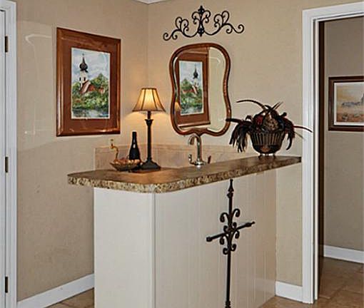 Wet bar with sink and built in refrigerator.