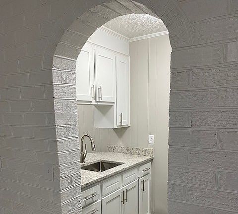 Painted Brick Archway into modern Kitchen