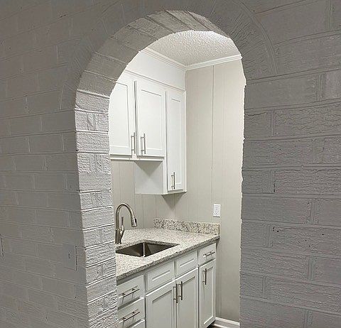 Painted Brick Archway into modern Kitchen