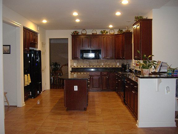 Gourmet Kitchen with Granite Countertop and ceramic tile, double wall oven+