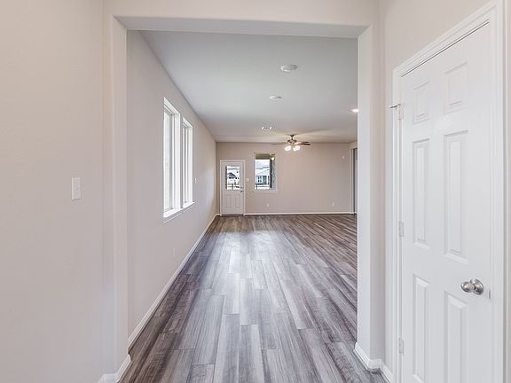 Entryway into open concept living room, dining room and kitchen