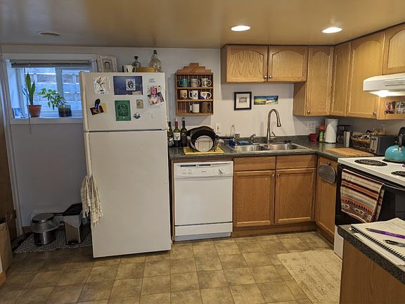 Very large, open kitchen with dishwasher and new stove