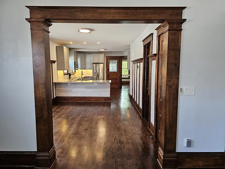 View from living room into dining room. All woodwork was refinished to it's original condition.