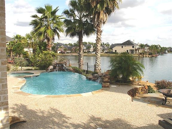 FABULOUS SALT WATER POOL-SPA WITH 2 ROCK WATERFALLS + A DISAPPEARING MIDDLE WATERFALL TO THE LOWER POOL LEVEL!