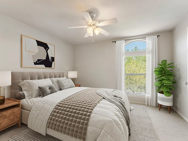 Bedroom. Furnishings are staged.