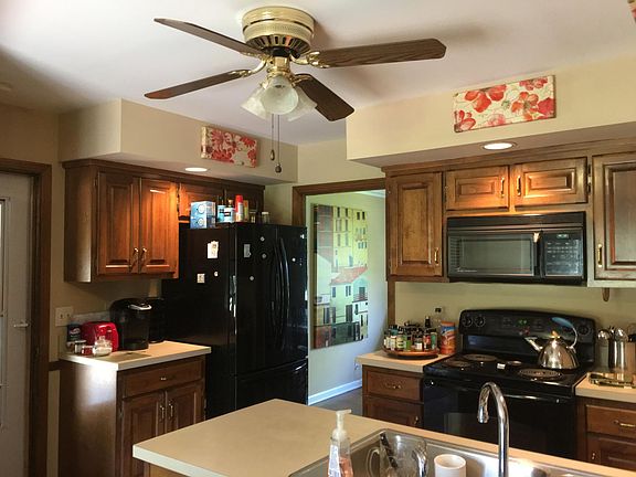 Kitchen with refrigerator, microwave, range, dishwasher