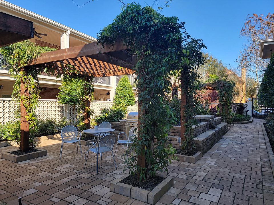Courtyard with Gazebos, Sitting area, BBQ grill and Waterfall fountain.