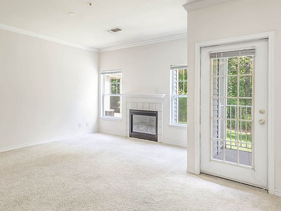 Living Room with Fireplace and Balcony