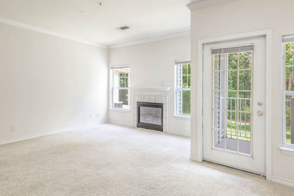 Living Room with Fireplace and Balcony