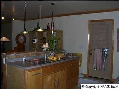 kitchen with island bar and cook top