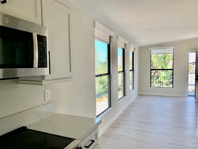 living room with windows and exterior door