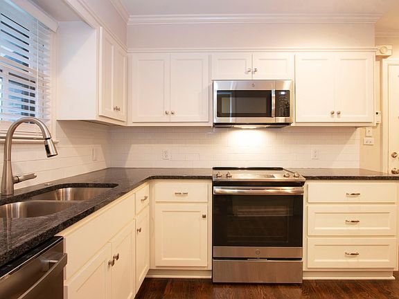 Remodeled kitchen. All new cabinets, counter tops, appliances, and fixtures. Re-stained hardwood floors, all new paint.