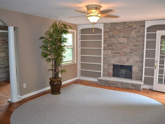 Custom Stone Fireplace with dual bookshelves.