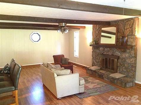 Open living room with lots of natural light and French Doors that exit to the patio.