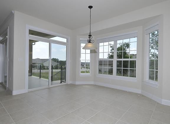 Lots of windows let the light in, custom blinds keep it out.