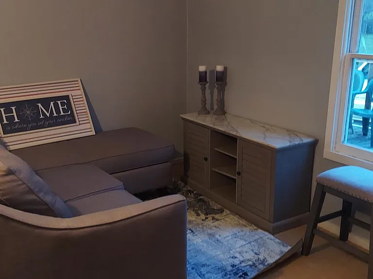 Living area adjacent to kitchen for relaxing in A/c or near the kitchen