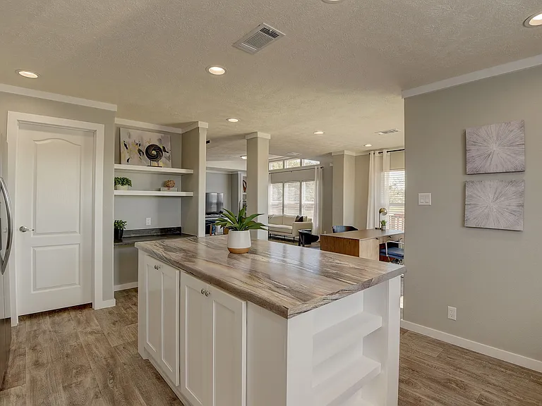 Light-filled, open-concept kitchen featuring a statement island, sleek cabinetry, and seamless flow into the living space_designed for elevated everyday living and effortless entertaining.