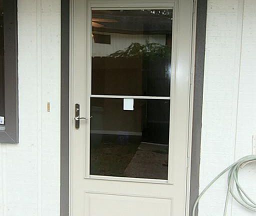 Storm door entrance with security feature.