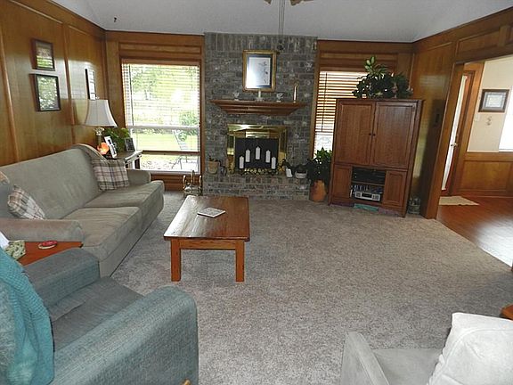 Wonderful Den with Rich Woodwork and recent Plush Carpet.