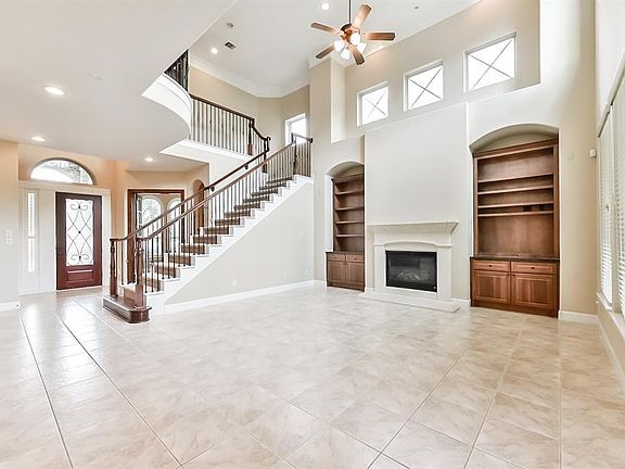 Open and bright living spaces with many windows and built ins.