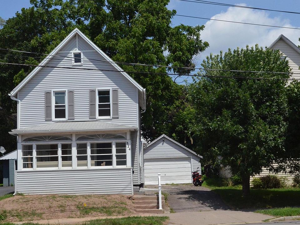 House Front View with Driveway & Garage
