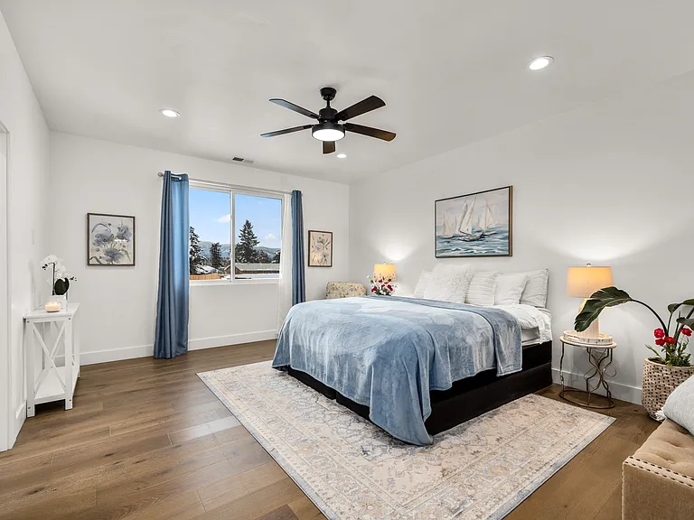 Peaceful primary suite surrounded by calming mountain and treetop views, creating the perfect private retreat to unwind and relax. Complete with a beautifully appointed en-suite bath for a true spa-like Montana escape.