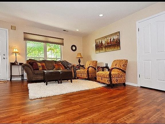 Living room with spacious closet under steps