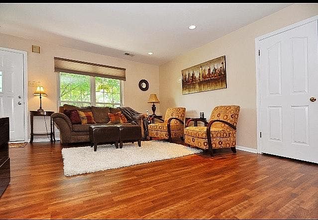 Living room with spacious closet under steps