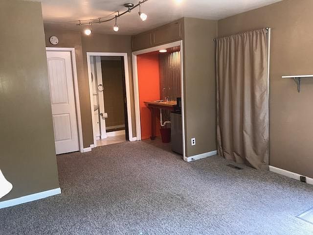 Showing bath and kitchenette